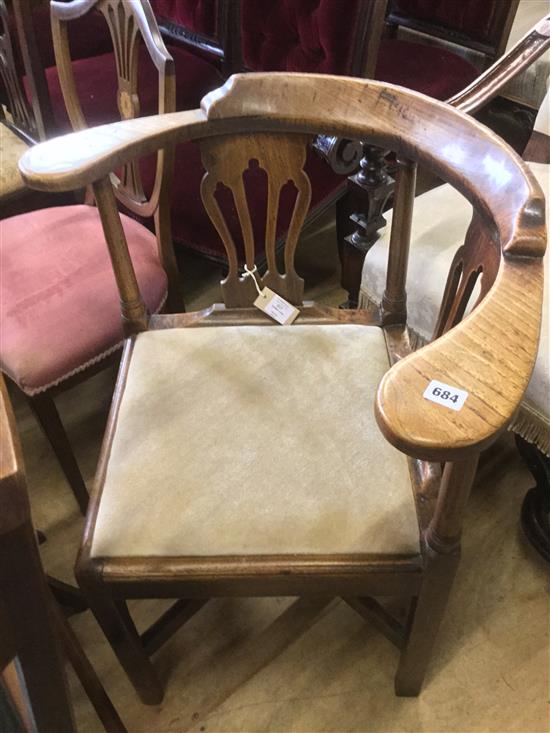 A George III elm corner chair,